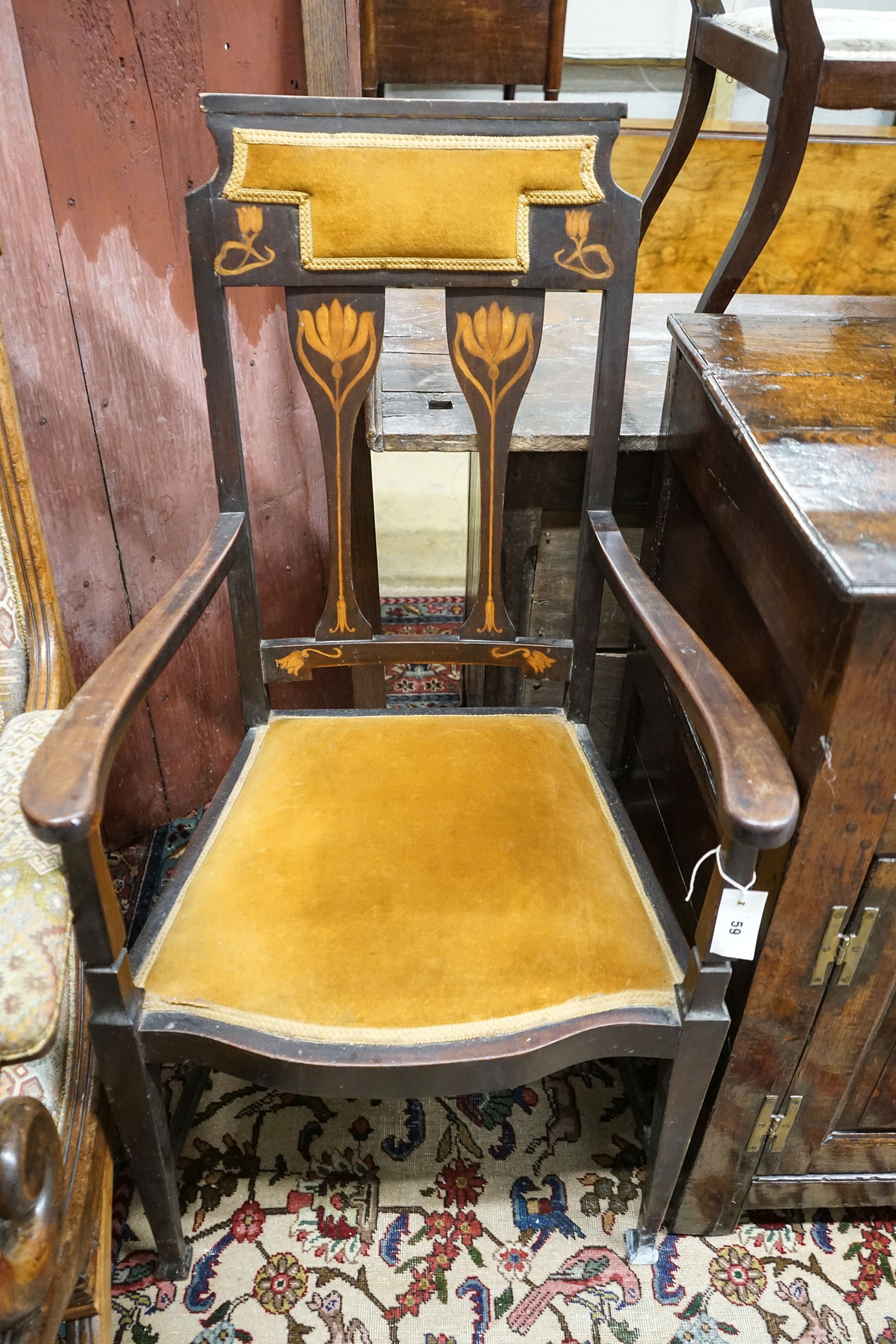 An Edwardian Art Nouveau inlaid mahogany elbow chair, width 59cm, depth 58cm, height 109cm